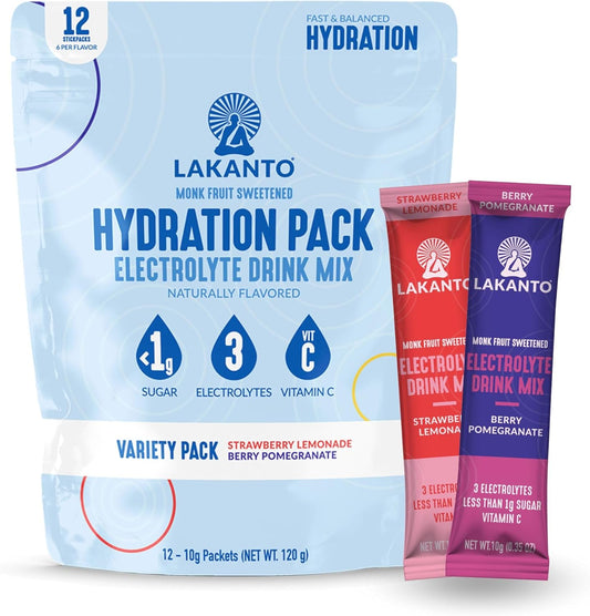 The Lakanto Sugar Free Hydration Pack Electrolyte Drink Mix Variety Pack includes strawberry lemonade and berry pomegranate flavors with essential electrolytes, 1g sugar, and vitamin C. Pictured are two sachets, ideal for on-the-go refreshment.