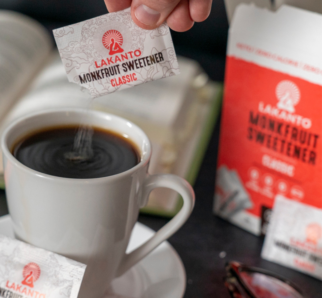 classic sweetener sachet being poured on coffee